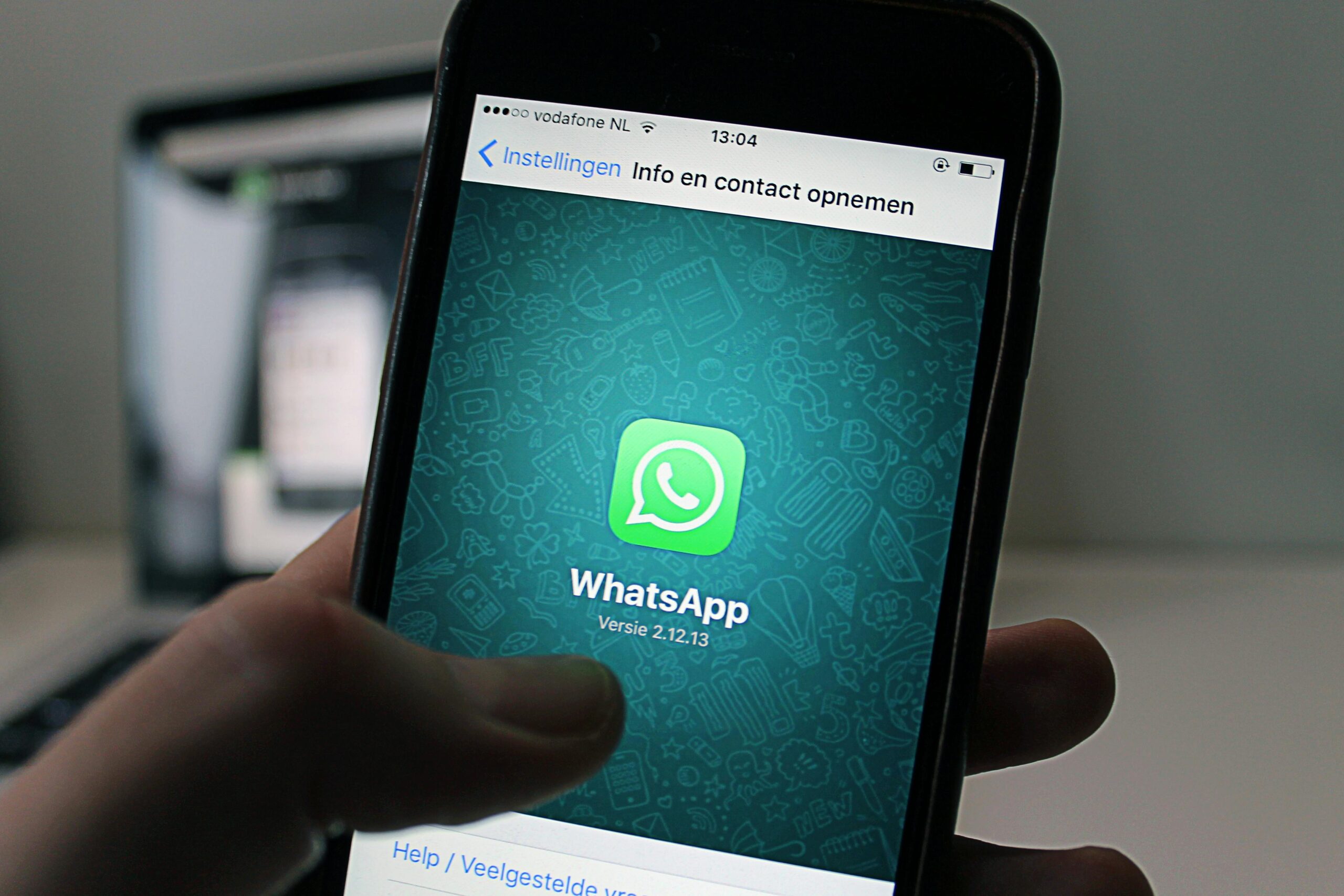 Smartphone showing delayed WhatsApp message notifications